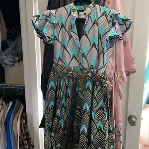 Beautiful handmade party dress hits at the knee.